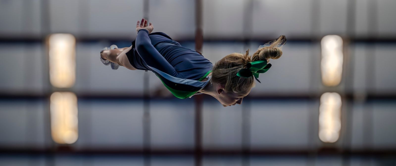 A flyer in a full layout above the gym floor